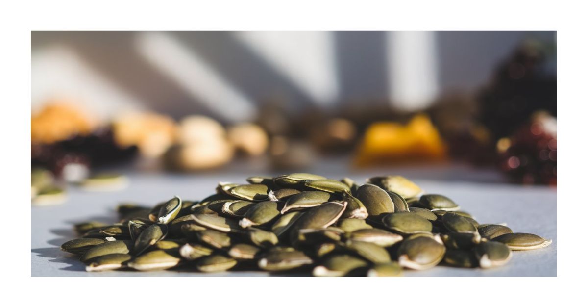 A handful of pumpkin seeds showcasing their nutrient-rich content and health benefits.